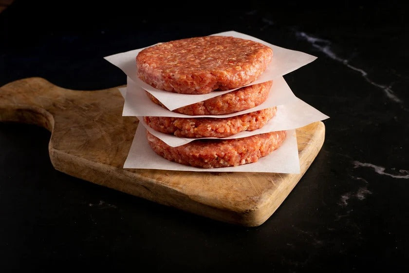 Raw, lightly seasoned turkey burger patties from Rancher’s Table.