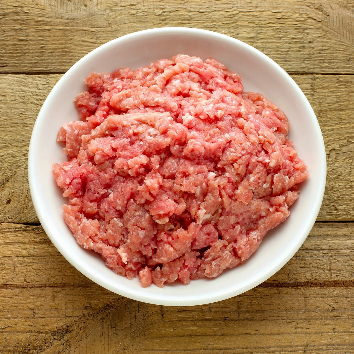 Raw ground turkey made from breast, thigh, and clean meat trimmings from Rancher’s Table. Mexico Organic Meats
